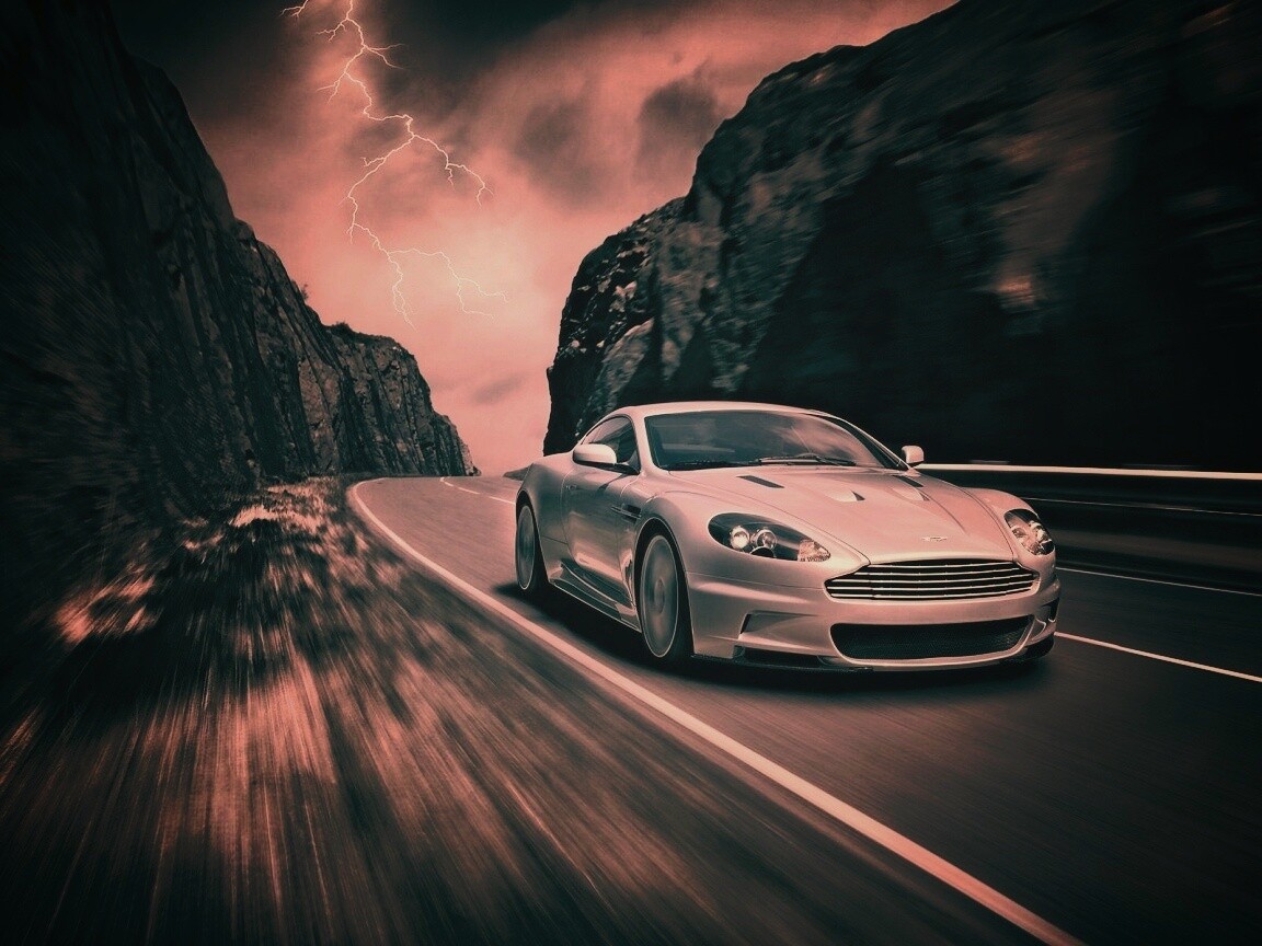 Астон мартин на горной дороге обои