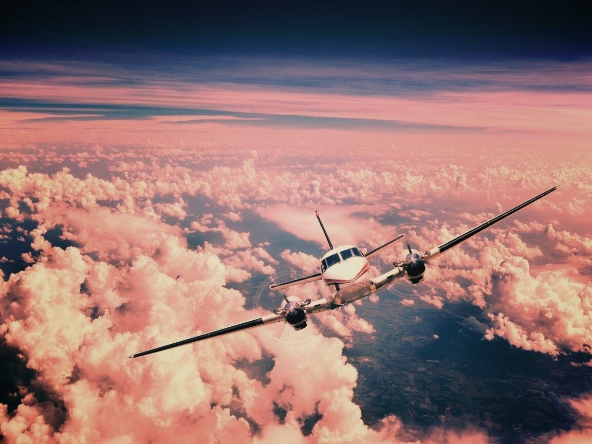 Самолет над облаками обои