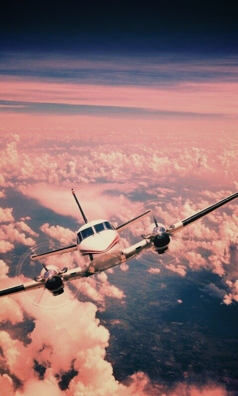 Самолет над облаками обои
