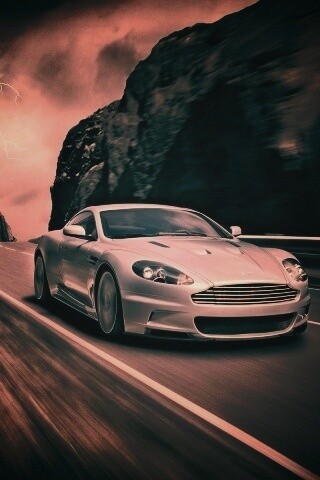 Астон мартин на горной дороге обои