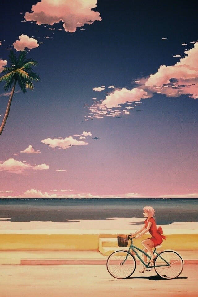 Девушка едет на велосипеде вдоль берега обои