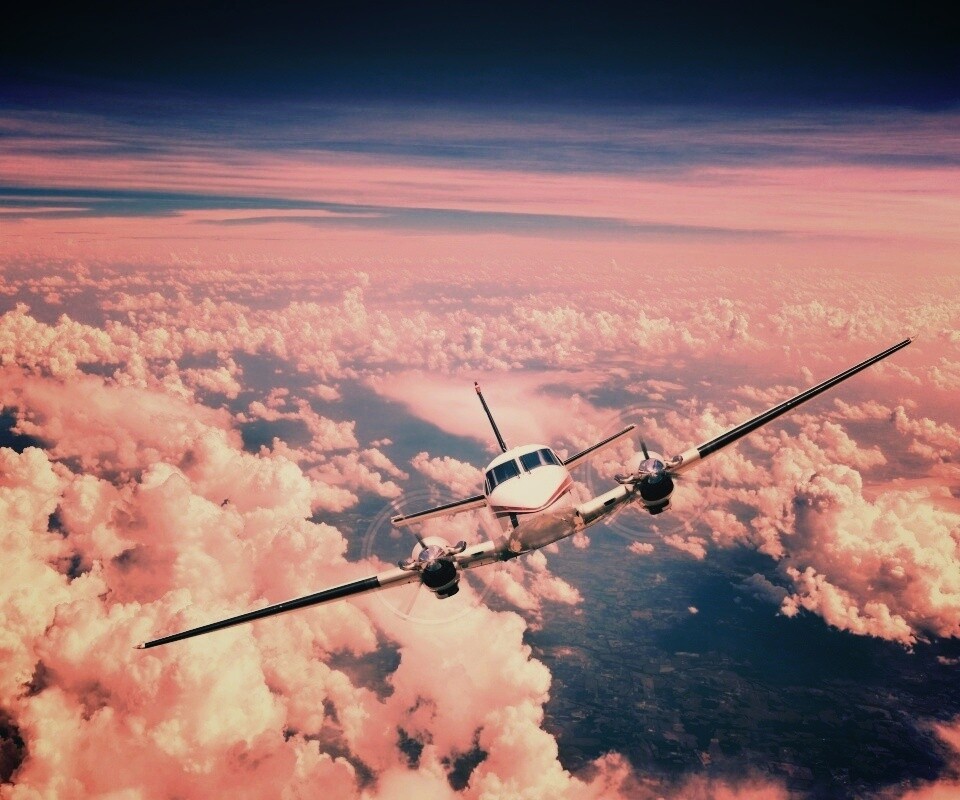 Самолет над облаками обои
