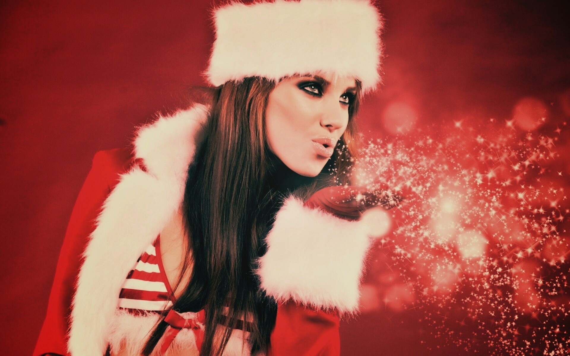 Снегурочка дует на снежинки обои