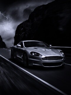 Астон мартин на горной дороге обои
