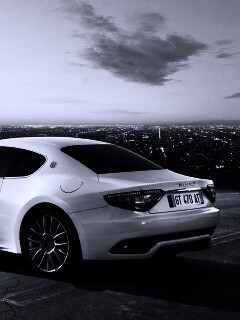 Maserati Granturismo на фоне города обои