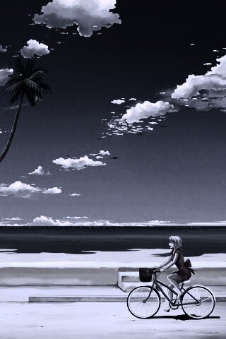 Девушка едет на велосипеде вдоль берега обои