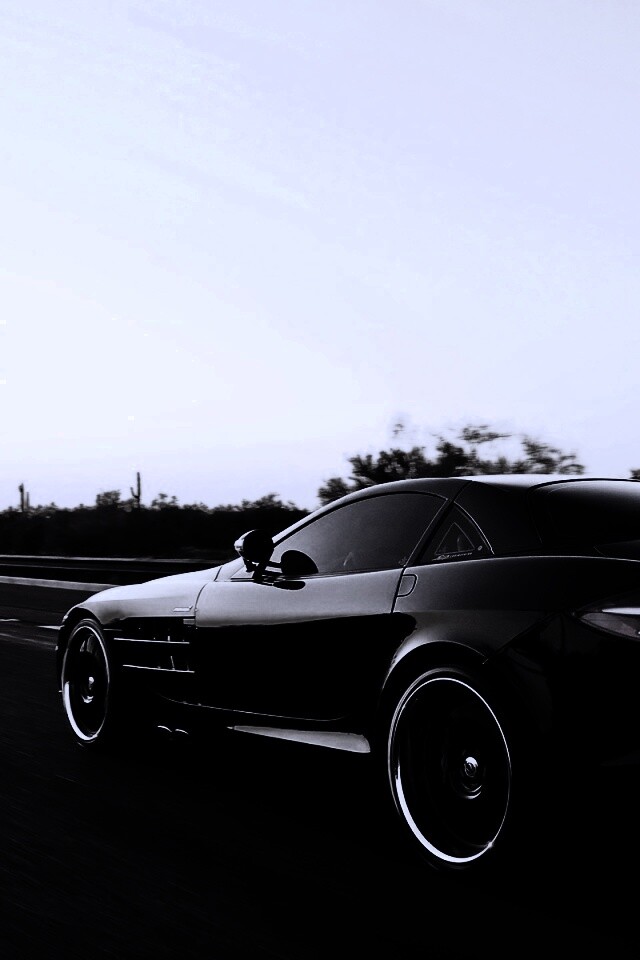 Черный автомобиль уезжает в закат обои