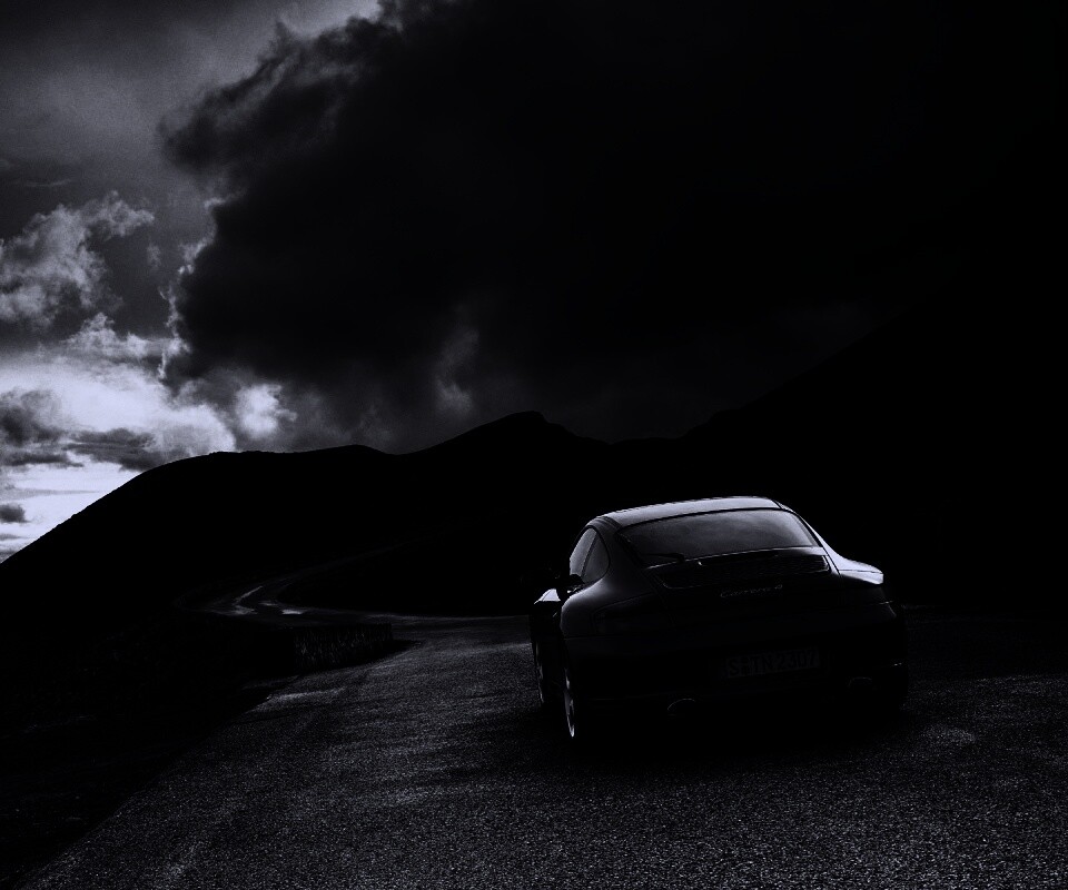 Черный Порше на горной дороге обои