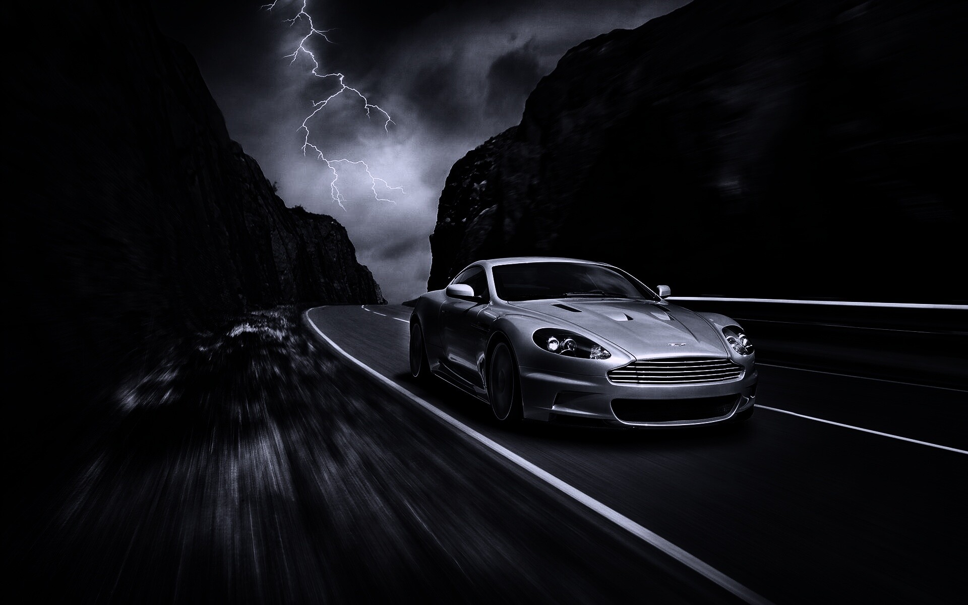 Астон мартин на горной дороге обои