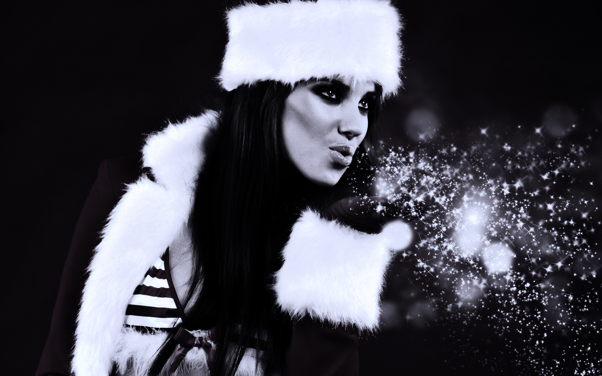 Снегурочка дует на снежинки обои