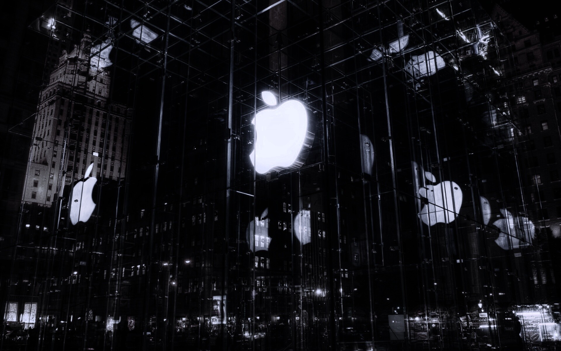 Отражение логотипа Apple в стеклянном здании обои