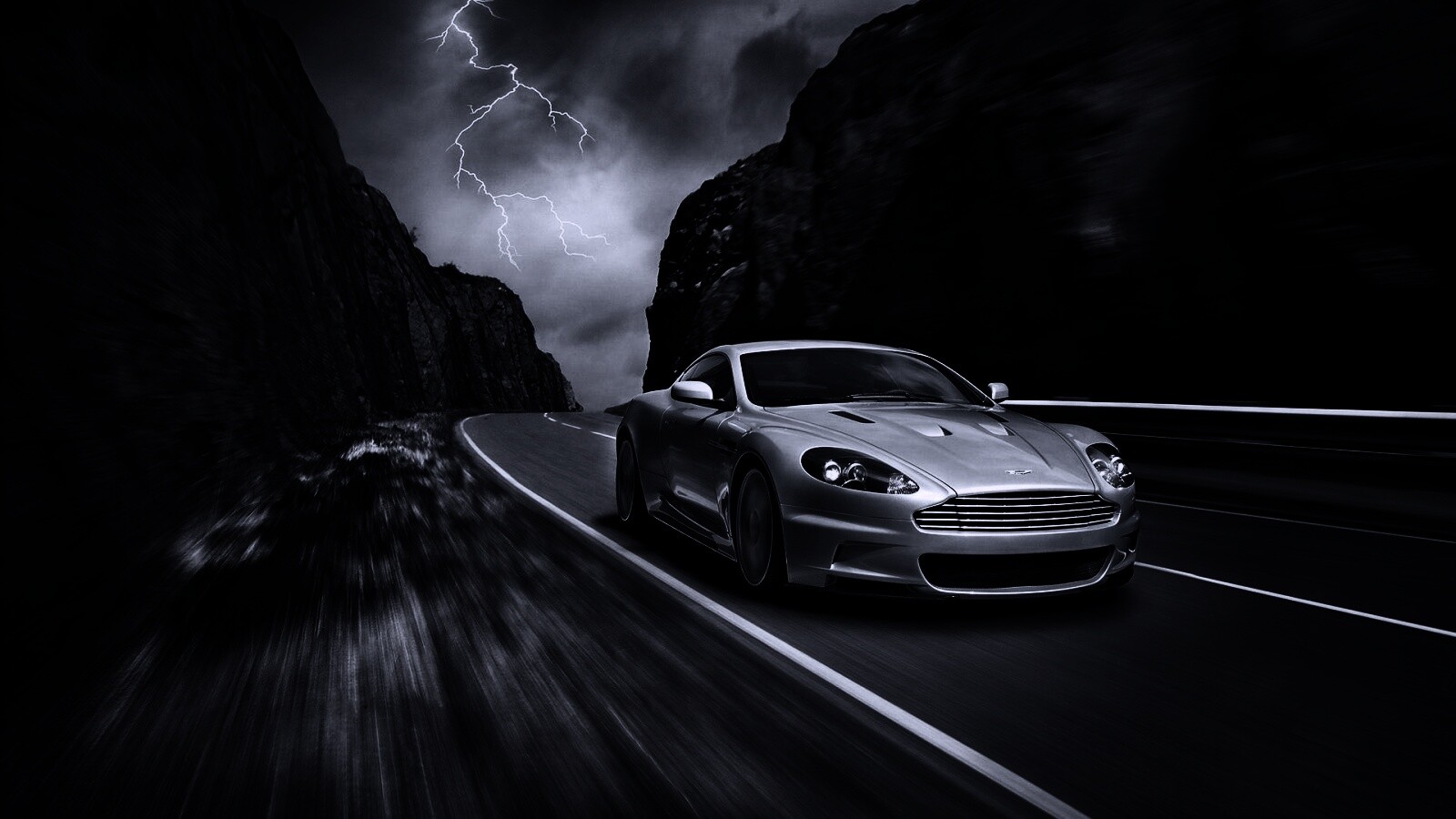 Астон мартин на горной дороге обои