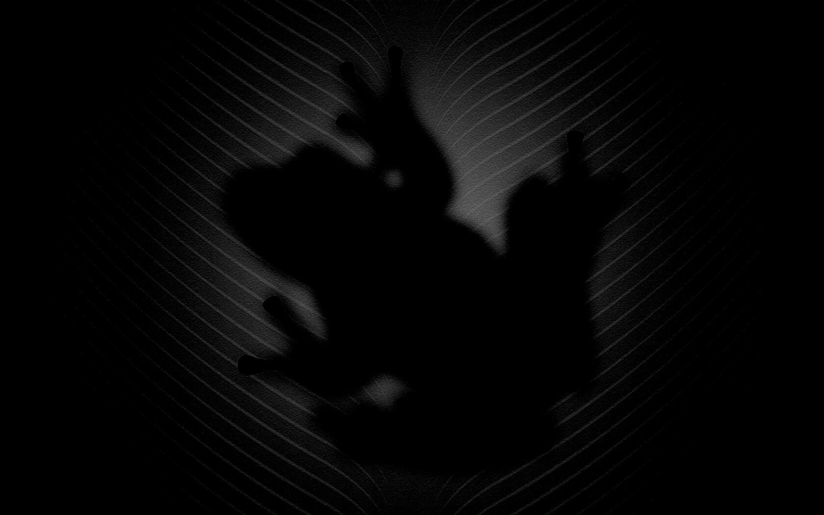 Силуэт лягушки просвечивает сквозь зеленый лист обои