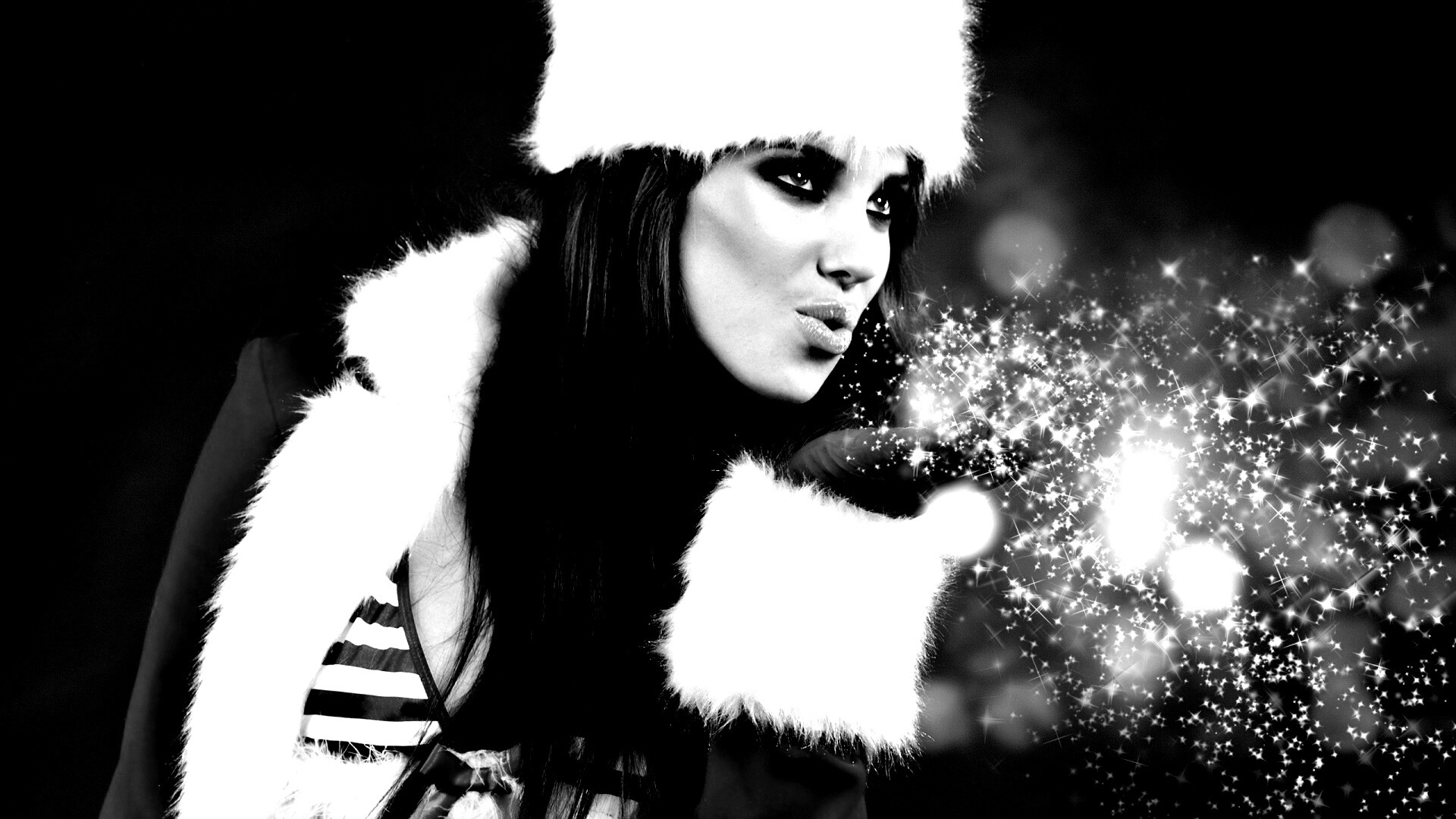 Снегурочка дует на снежинки обои