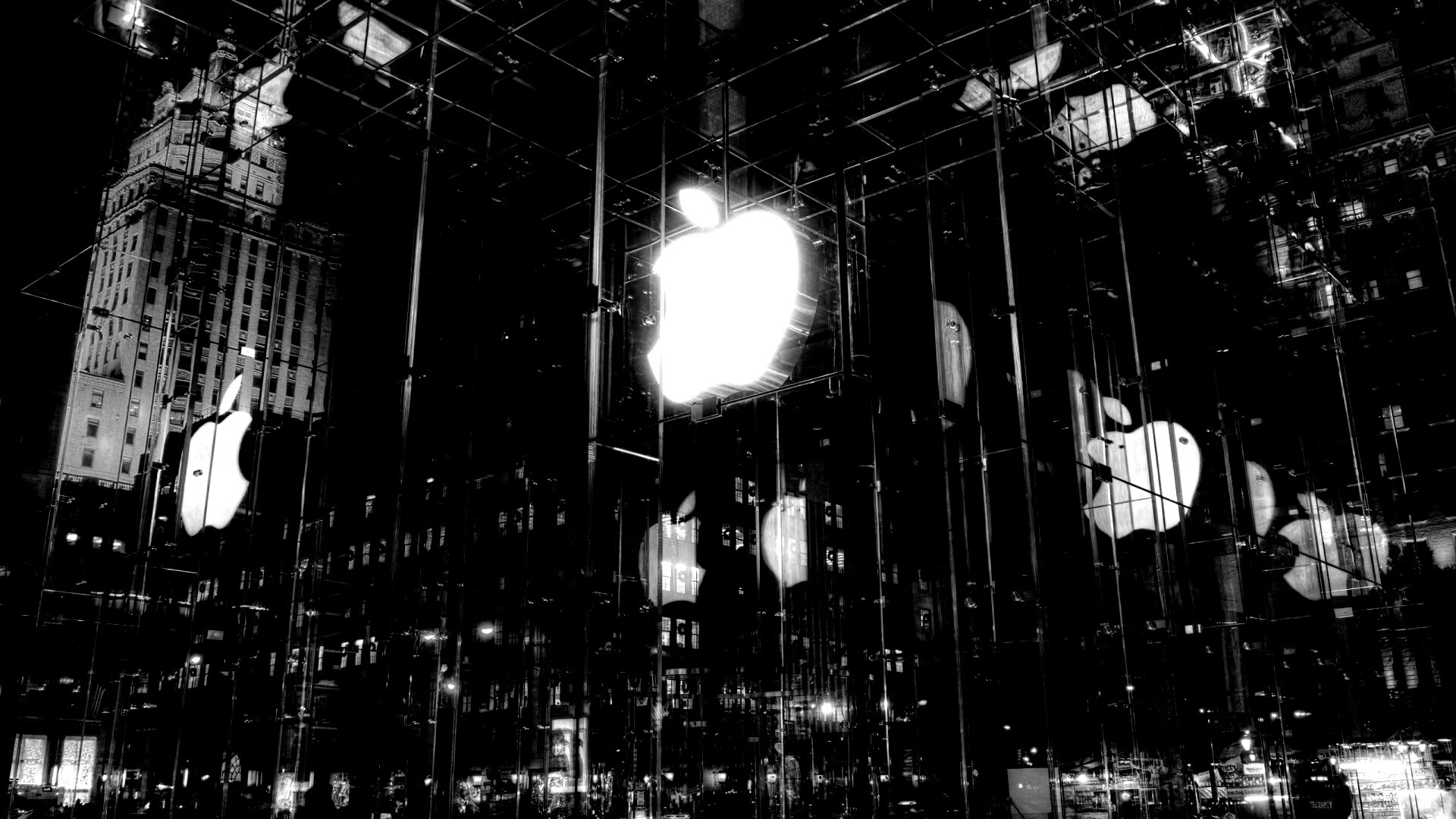 Отражение логотипа Apple в стеклянном здании обои