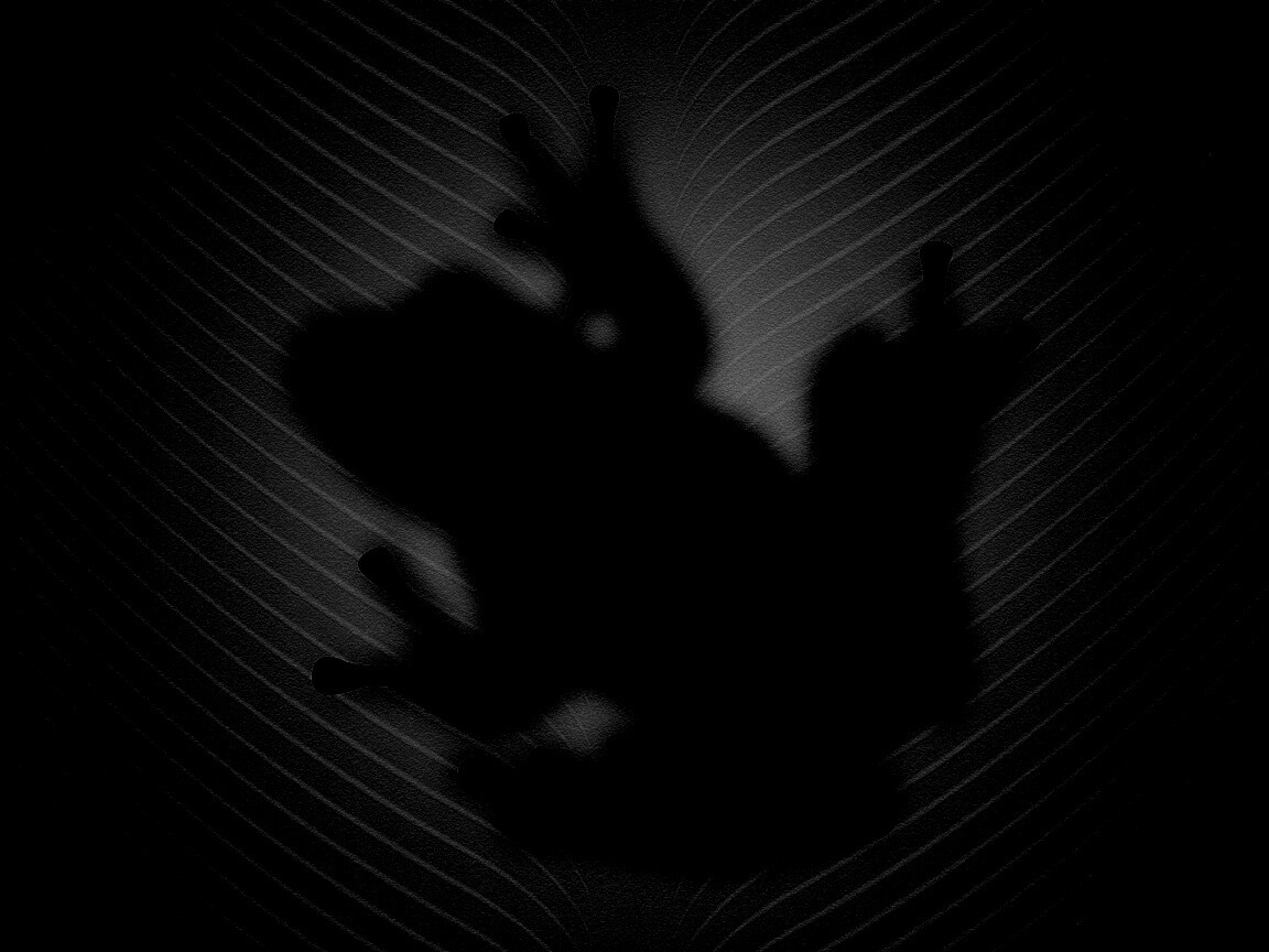 Силуэт лягушки просвечивает сквозь зеленый лист обои