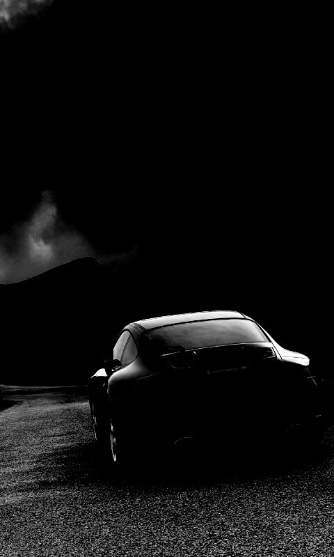 Черный Порше на горной дороге обои