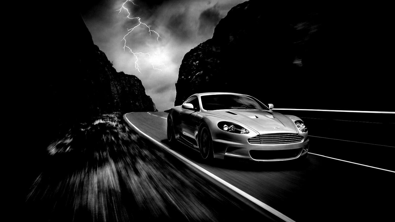 Астон мартин на горной дороге обои