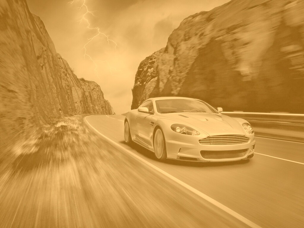 Астон мартин на горной дороге обои