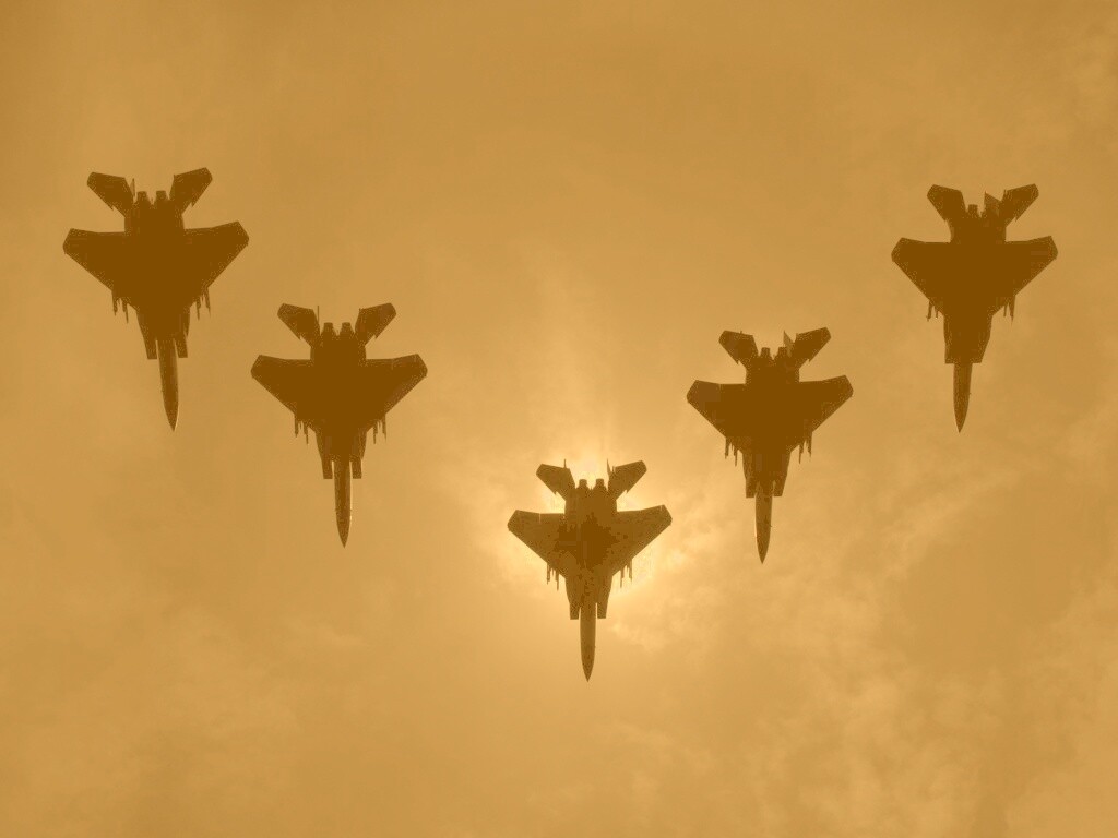 Ряд истрибителей на фоне солнца обои