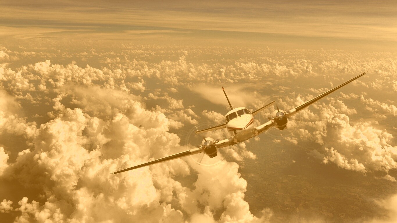 Самолет над облаками обои