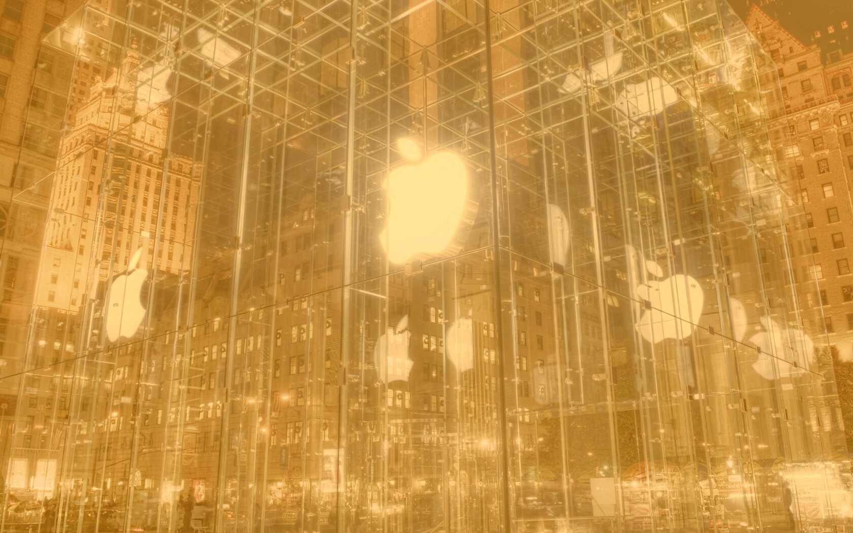 Отражение логотипа Apple в стеклянном здании обои