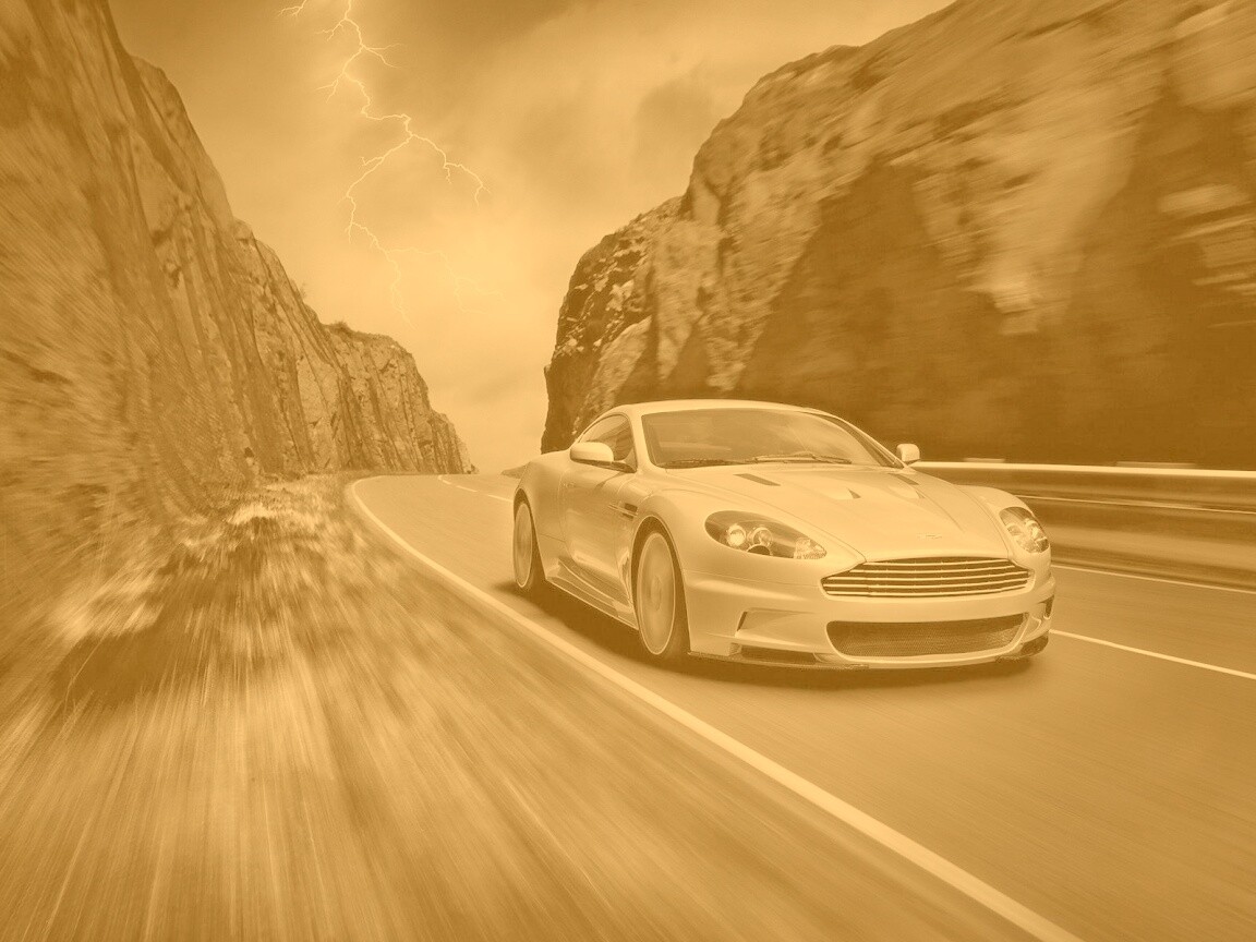Астон мартин на горной дороге обои