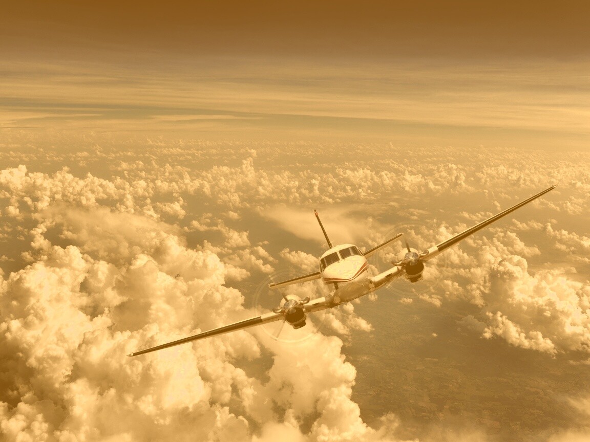 Самолет над облаками обои