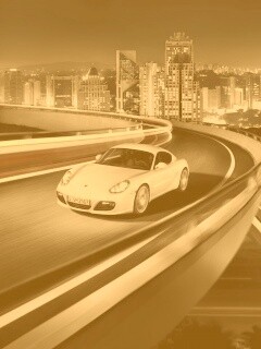 Черный и белый Porsche на автомагистрале. обои