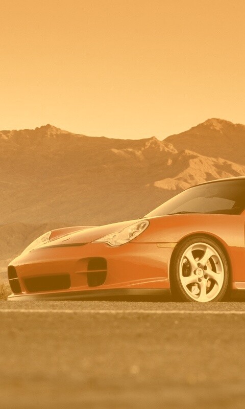 Красный Порше на фоне гор обои