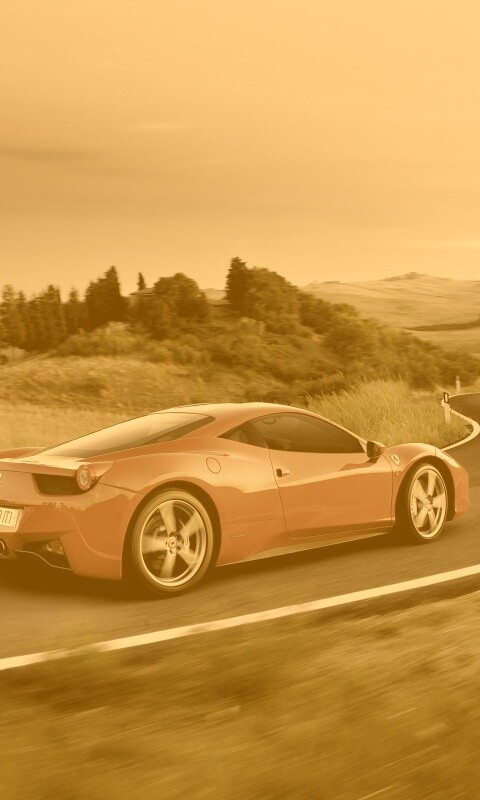 Красная феррари на извилистой дороге обои