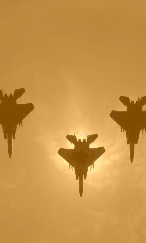 Ряд истрибителей на фоне солнца обои