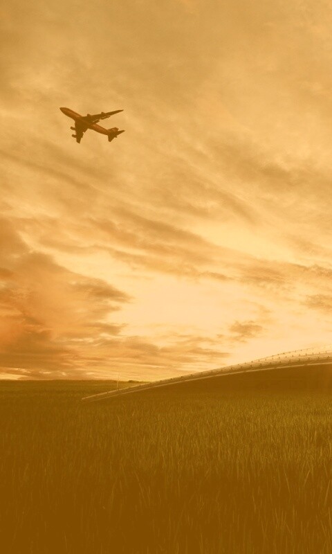 Самолет в закатном небе обои