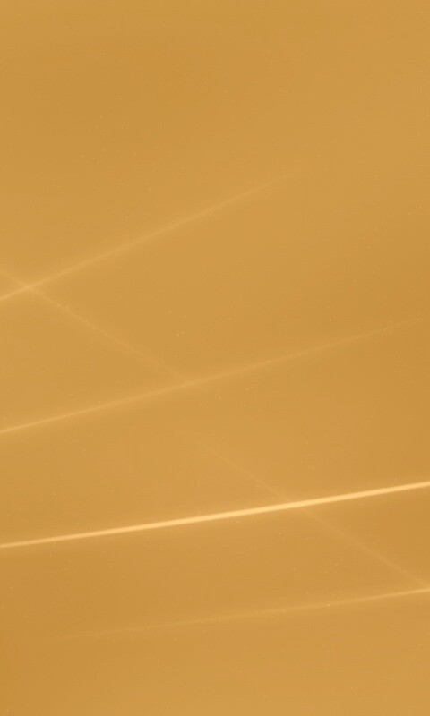 Лучи света на бронзовом фоне обои