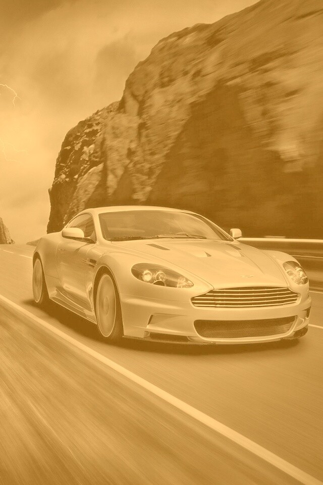 Астон мартин на горной дороге обои