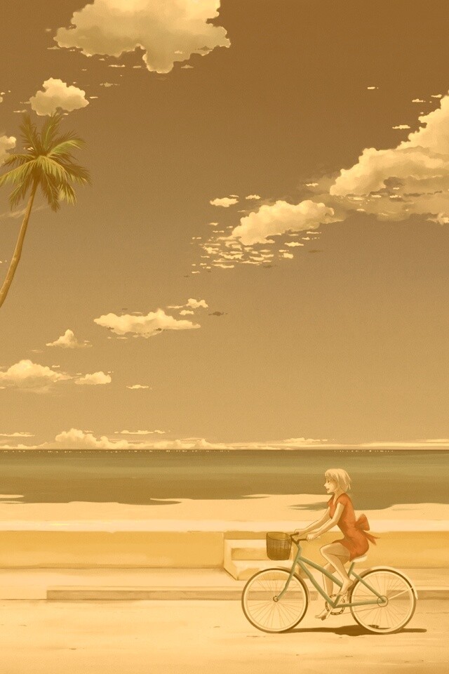 Девушка едет на велосипеде вдоль берега обои