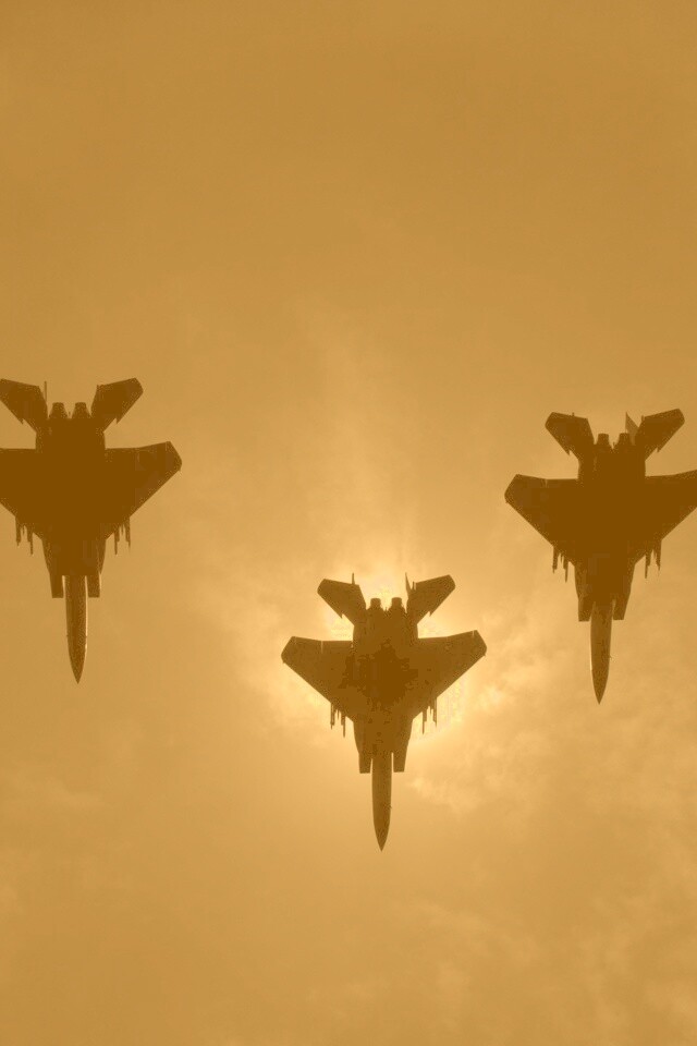 Ряд истрибителей на фоне солнца обои