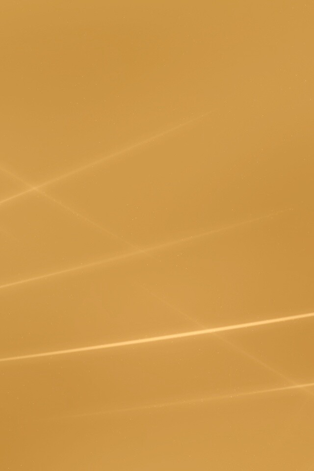 Лучи света на бронзовом фоне обои