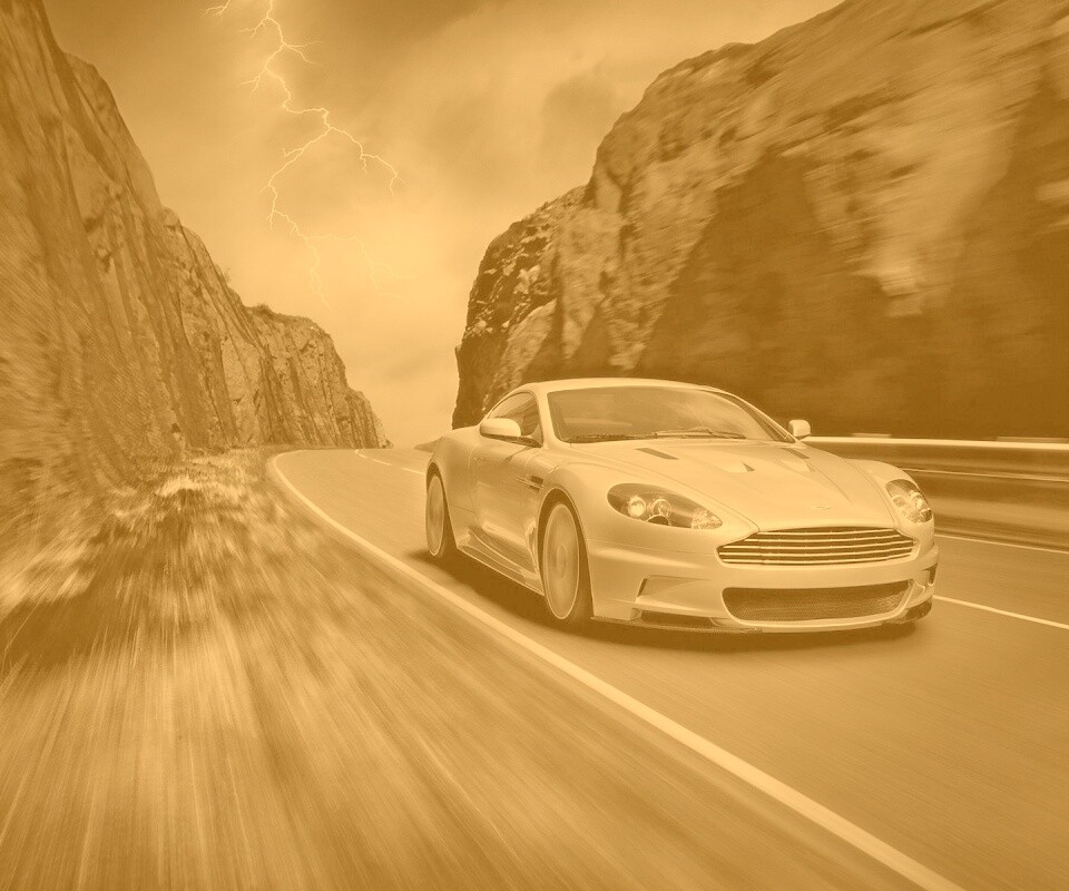 Астон мартин на горной дороге обои