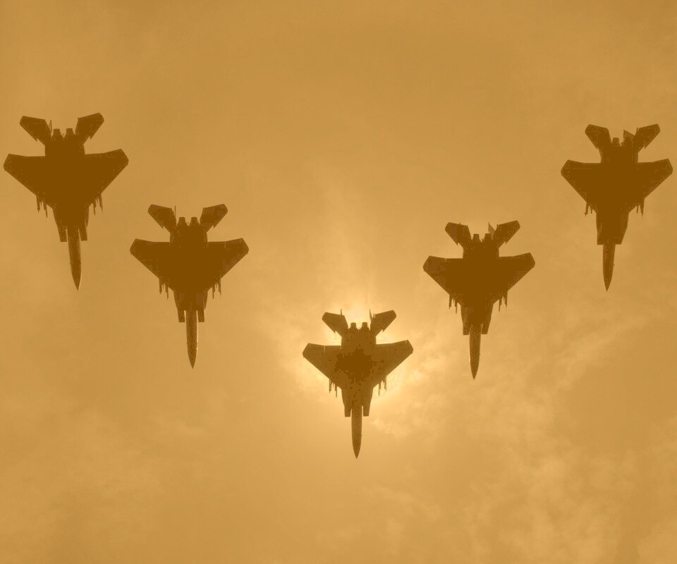 Ряд истрибителей на фоне солнца обои