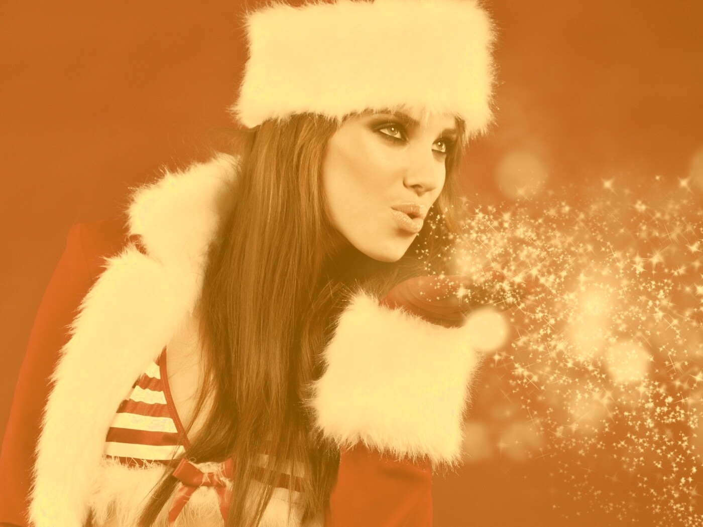 Снегурочка дует на снежинки обои