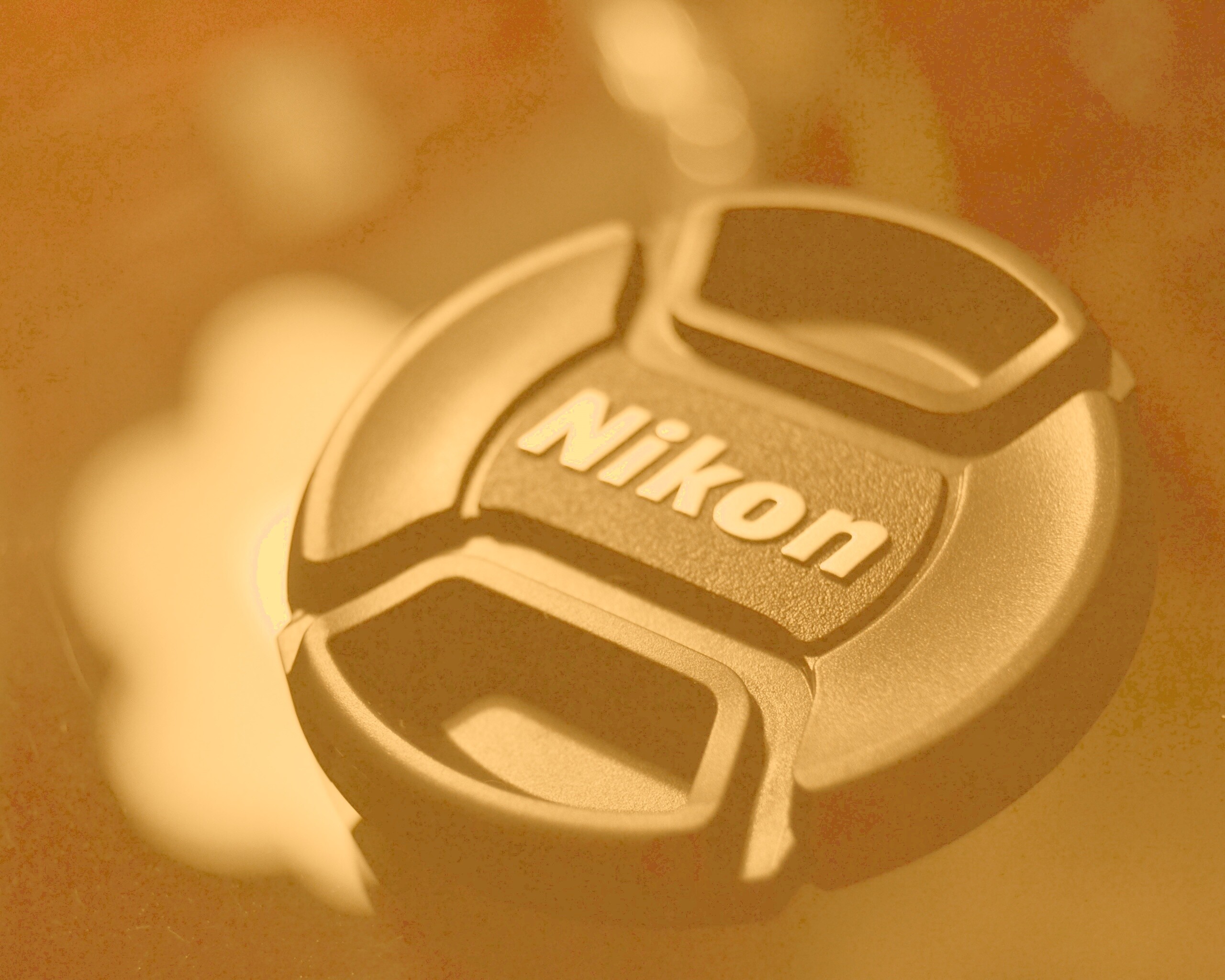 Крышечка от объектива Nikon обои