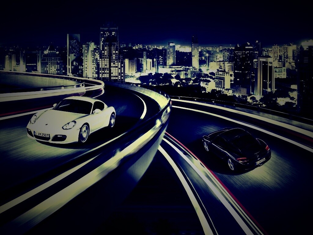 Черный и белый Porsche на автомагистрале. обои