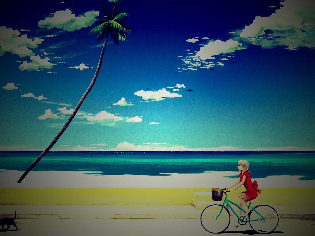 Девушка едет на велосипеде вдоль берега обои