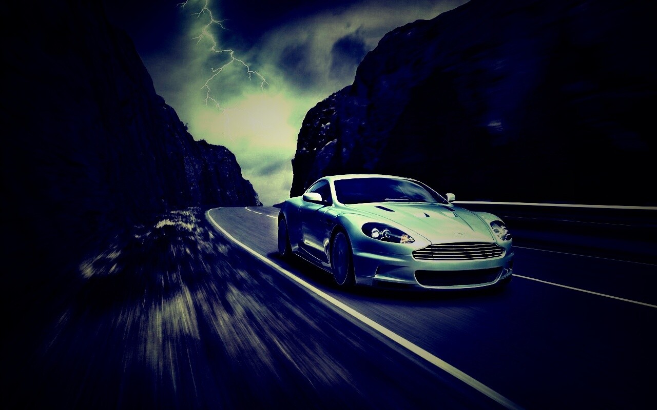 Астон мартин на горной дороге обои