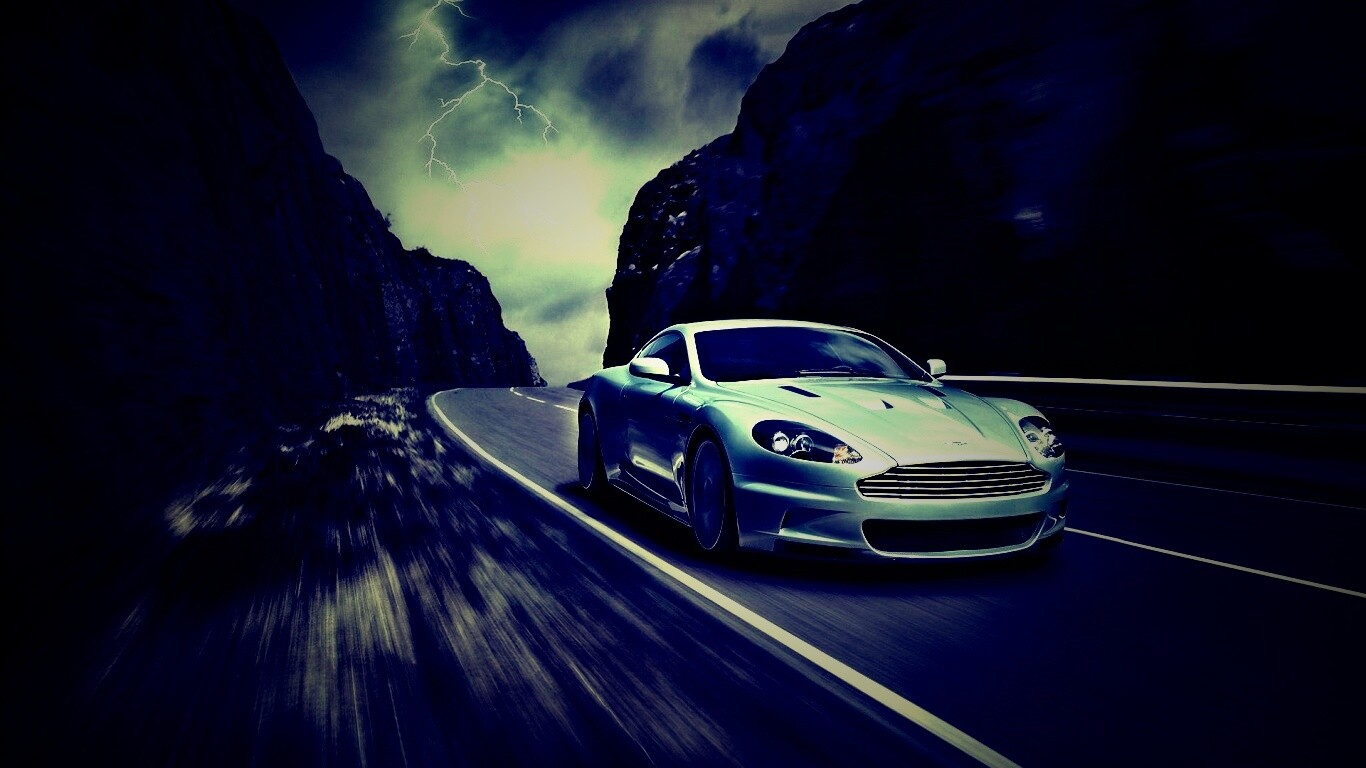 Астон мартин на горной дороге обои