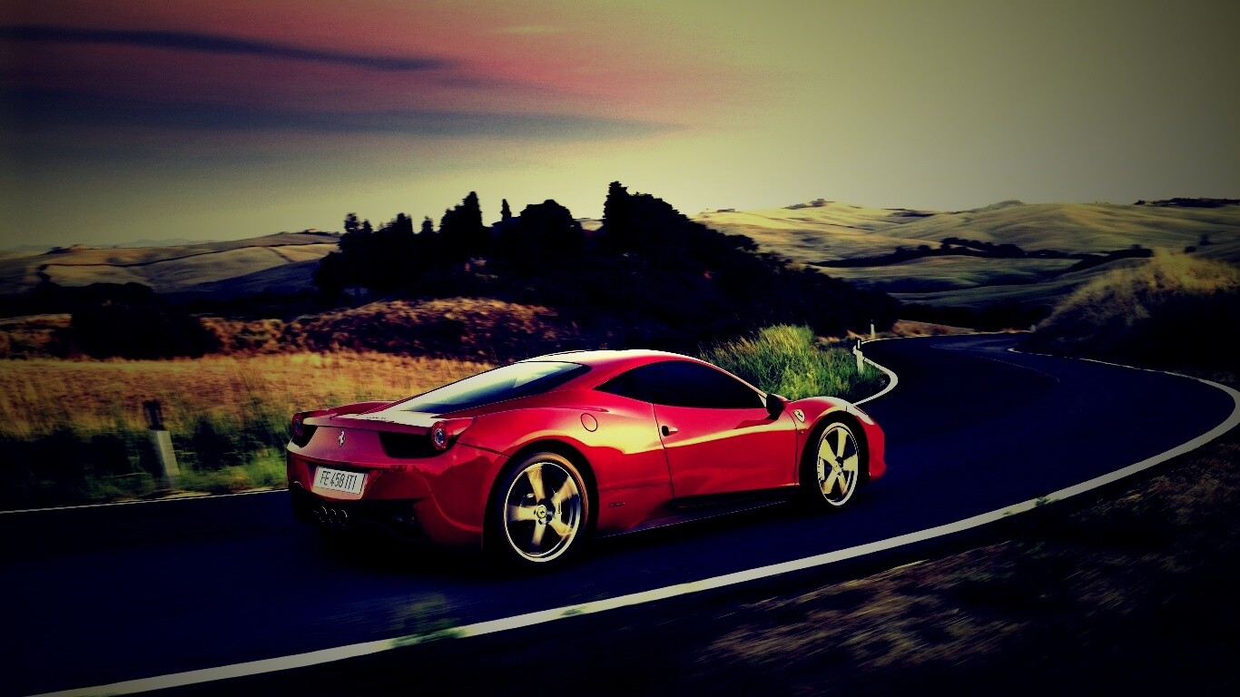 Красная феррари на извилистой дороге обои