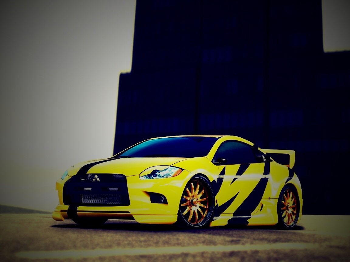 Mitsubishi жёлтого цвета с черными полосами обои