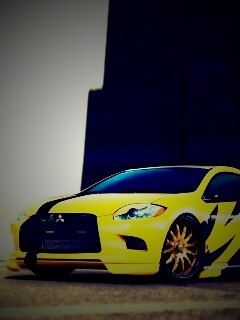 Mitsubishi жёлтого цвета с черными полосами обои