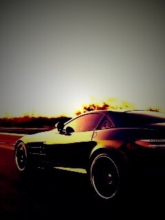 Черный автомобиль уезжает в закат обои